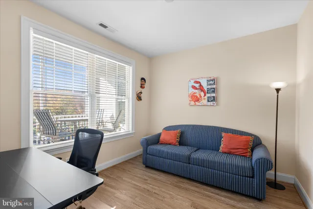 a bedroom with a bed and a night stand