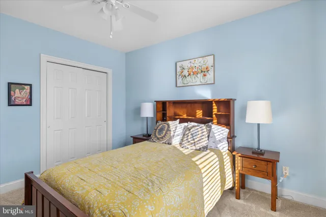 a spacious bedroom with a large bed and a large window