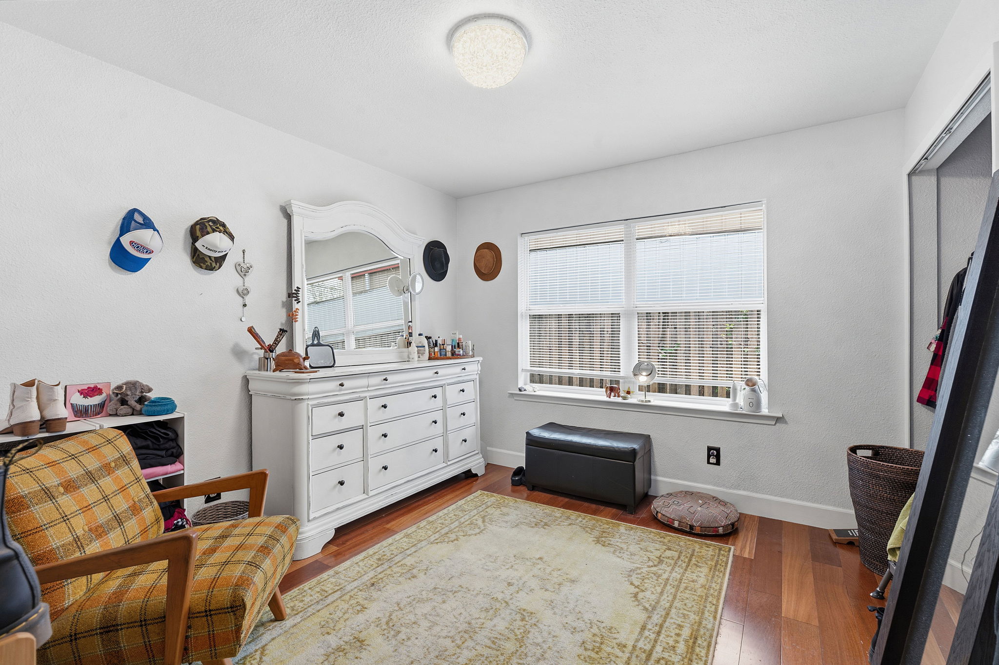 700 Corral Lane Austin, TX 78745 - Photo 17 of 26 a bedroom with furniture and a window