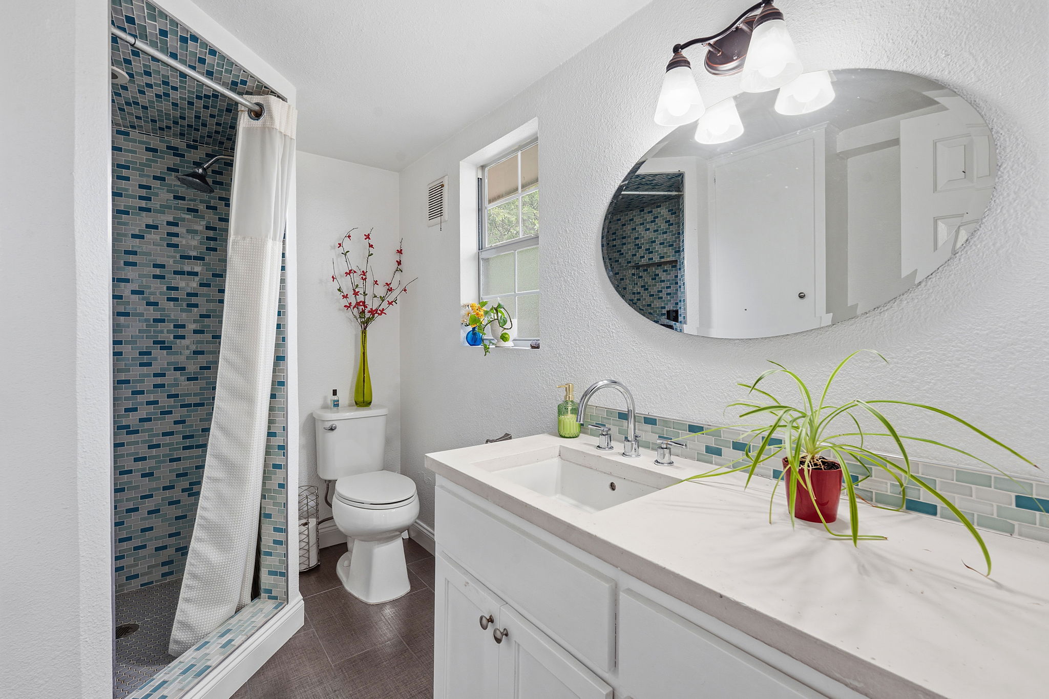 700 Corral Lane Austin, TX 78745 - Photo 20 of 26 a bathroom with a sink a toilet and a mirror