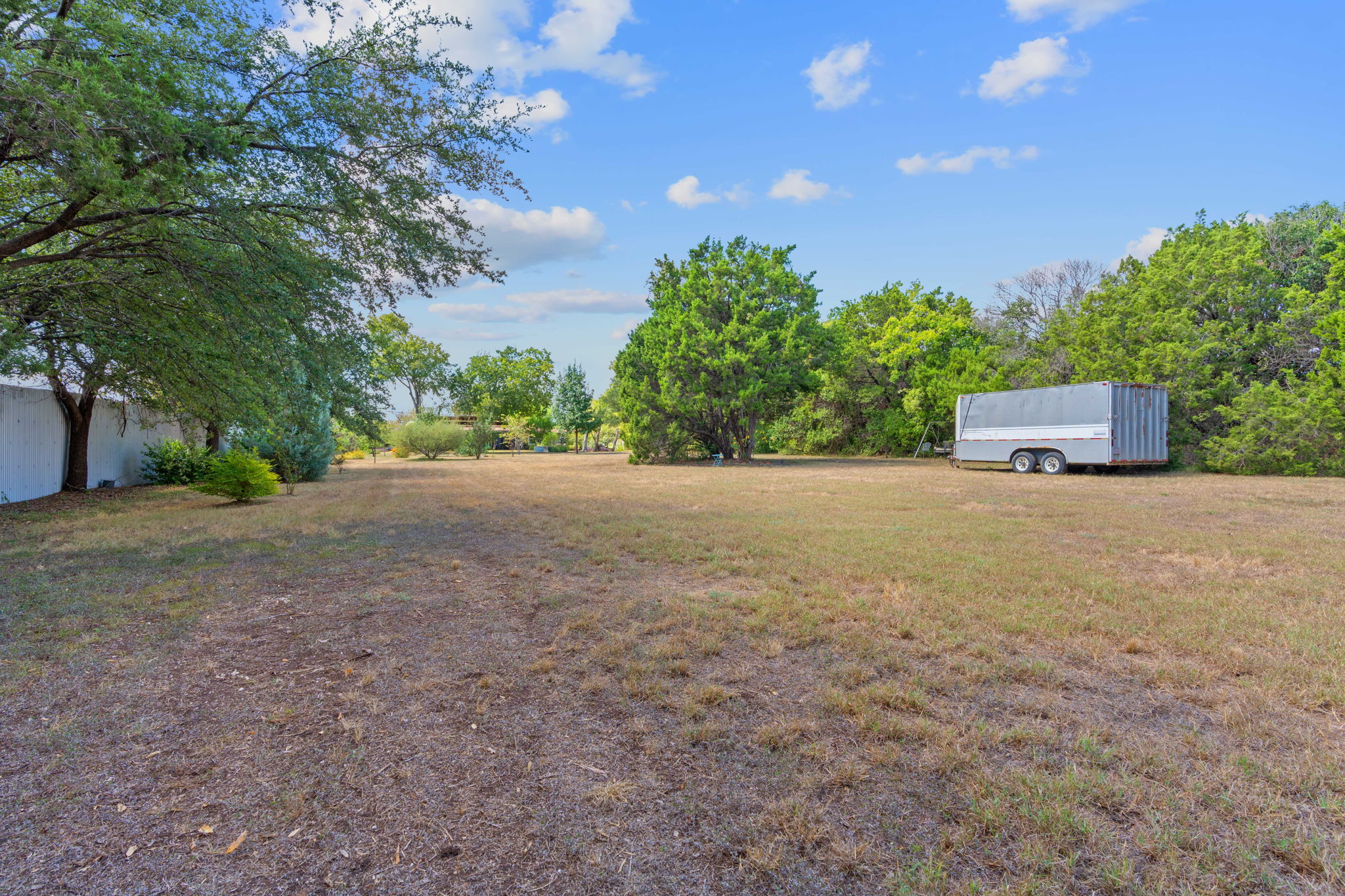 700 Corral Lane Austin, TX 78745 - Photo 2 of 26 a view of an outdoor space and a yard