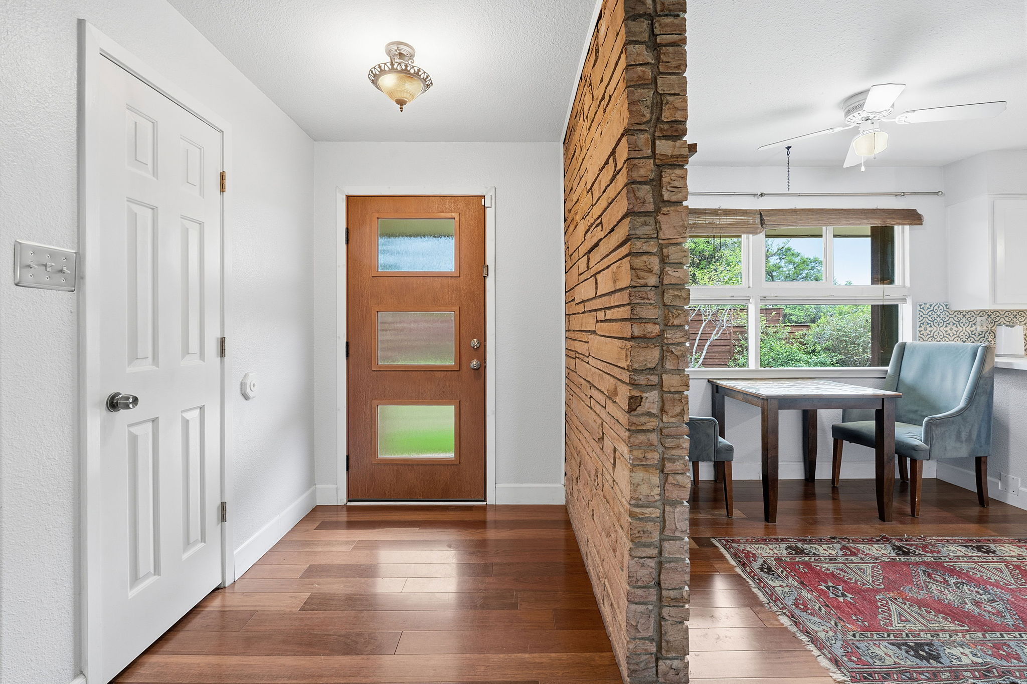 700 Corral Lane Austin, TX 78745 - Photo 5 of 26 a view of a hallway with furniture and a window