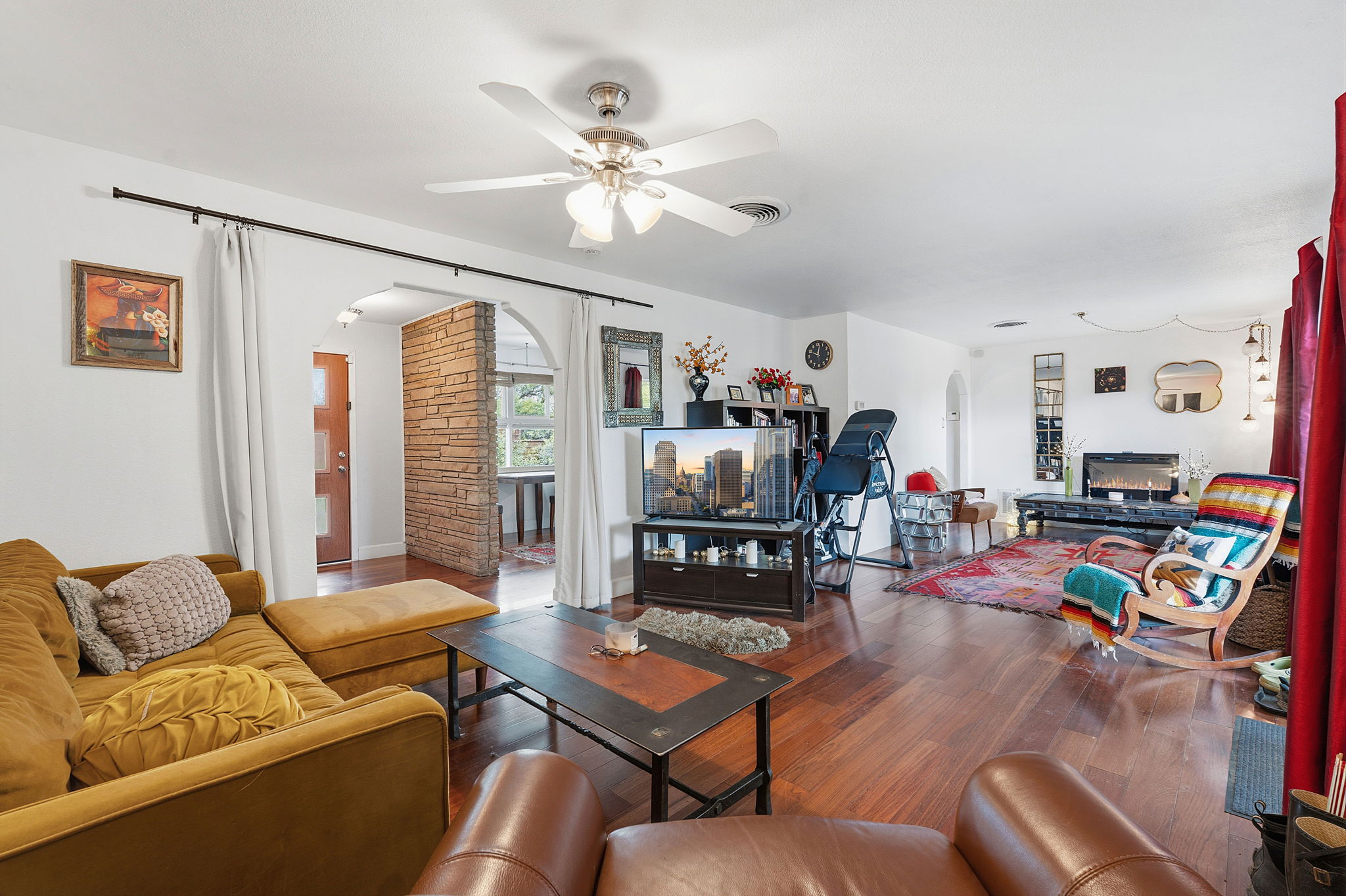 700 Corral Lane Austin, TX 78745 - Photo 9 of 26 a living room with furniture and a flat screen tv with wooden floor