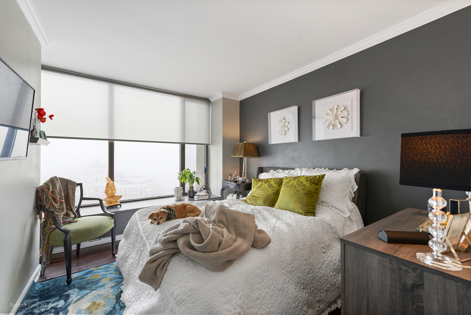 5455 North Sheridan Road, Unit 3105 Chicago, IL 60640 - Photo 14 of 18 a bedroom with a bed and a chair