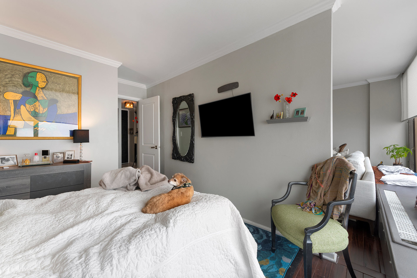 5455 North Sheridan Road, Unit 3105 Chicago, IL 60640 - Photo 16 of 18 a bedroom with a bed and a flat screen tv