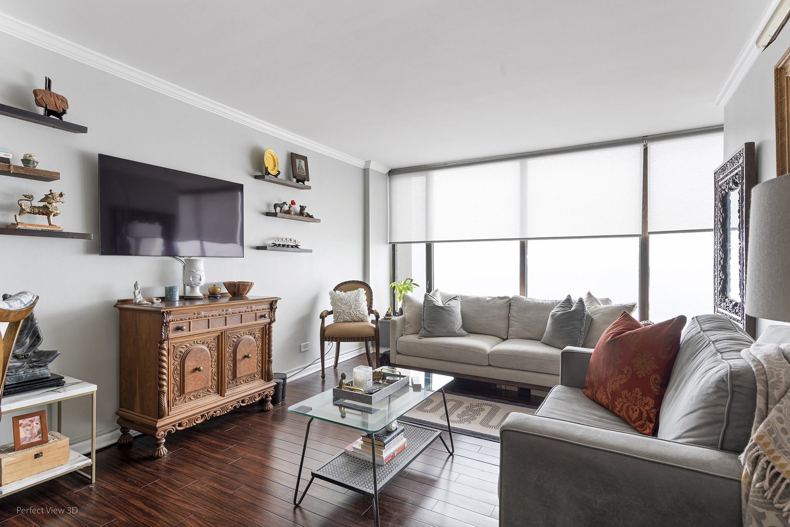5455 North Sheridan Road, Unit 3105 Chicago, IL 60640 - Photo 3 of 18 a living room with furniture a flat screen tv and a window
