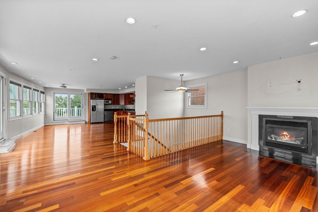 a view of livingroom with furniture wooden floor and fireplace