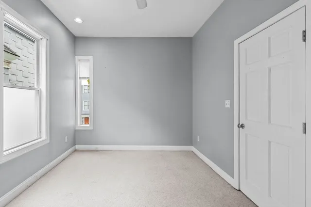 an empty room with windows