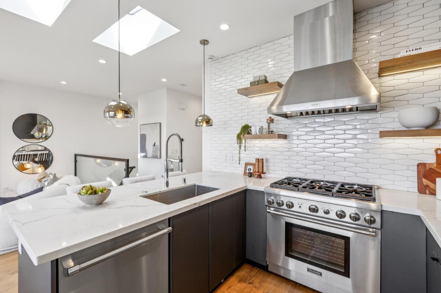 2271 40th Avenue San Francisco, CA 94116 - Photo 40 of 125 a kitchen with a sink a stove and cabinets