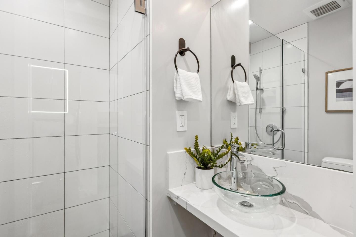 2271 40th Avenue San Francisco, CA 94116 - Photo 68 of 125 a bathroom with a sink and a mirror