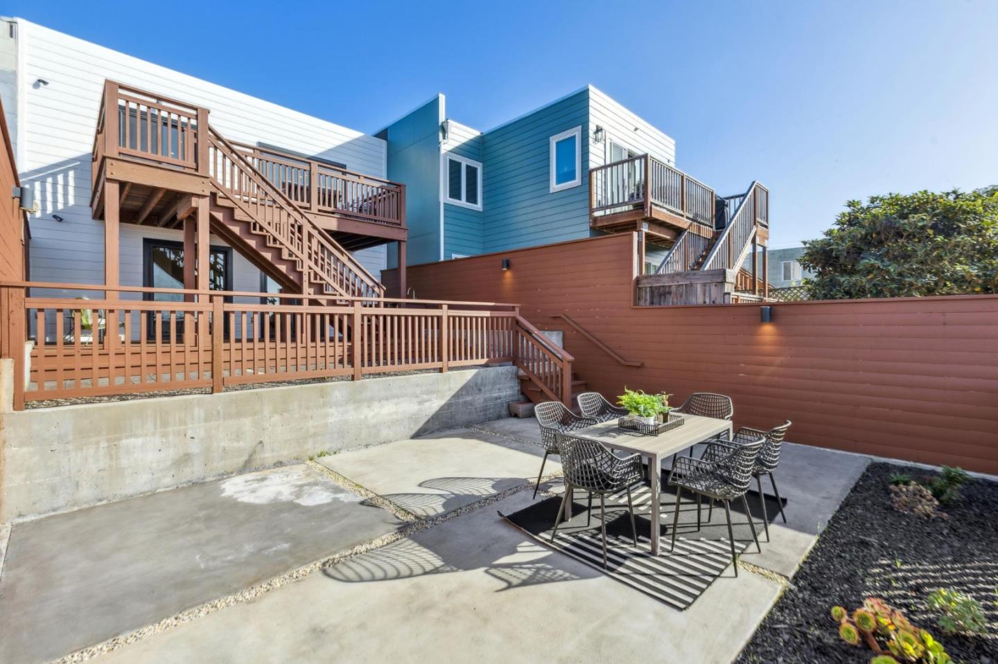 2271 40th Avenue San Francisco, CA 94116 - Photo 76 of 125 a view of a patio with couches table and chairs and potted plants