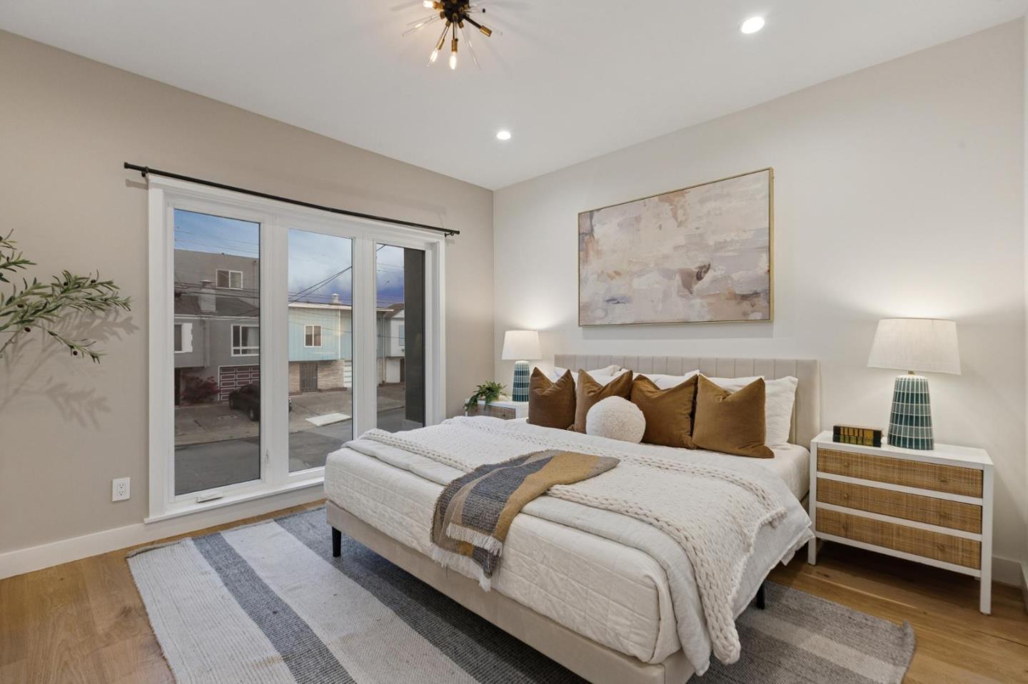 2271 40th Avenue San Francisco, CA 94116 - Photo 91 of 125 a bedroom with a bed and a night stand
