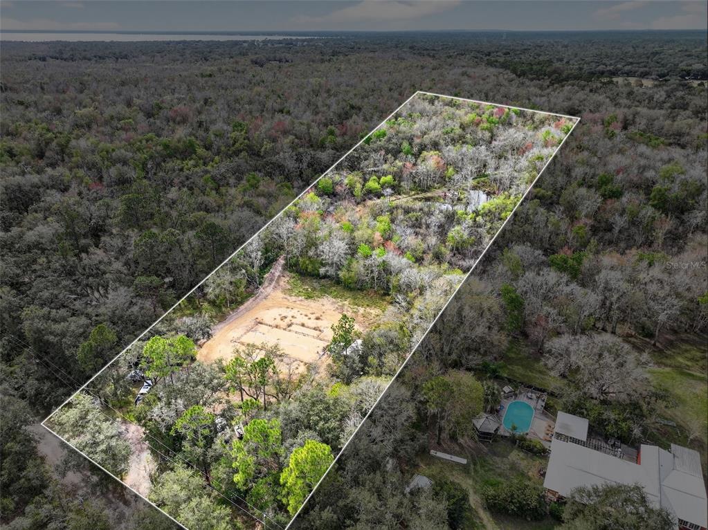 168 Walk In Water Creek Road Lake Wales, FL 33898 - Photo 11 of 15 a view of a yard with wooden fence