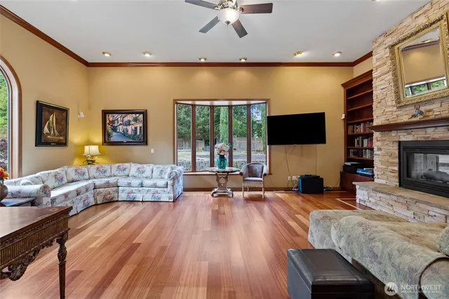 a living room with fireplace furniture and a flat screen tv