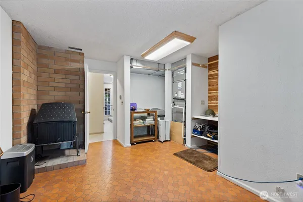 a bedroom with furniture and a closet