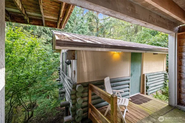 a backyard of a house with outdoor seating and plants
