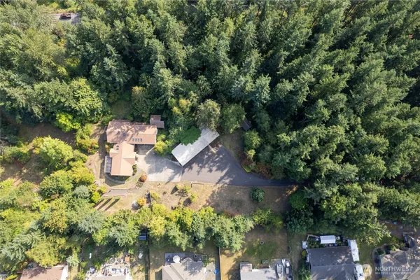 an aerial view of a house with outdoor space