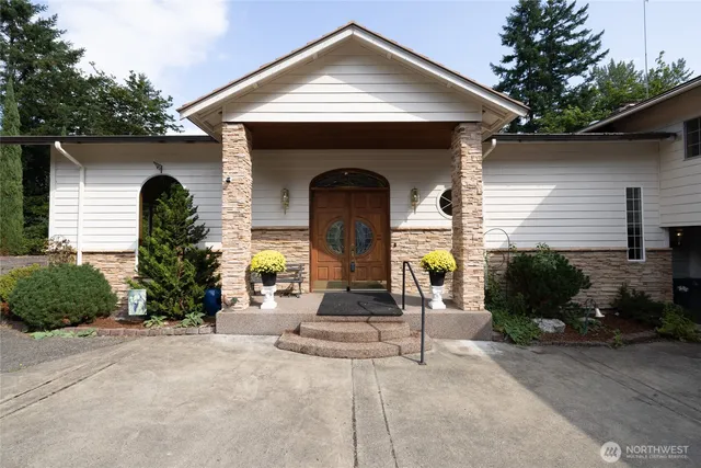 a front view of a house with garden