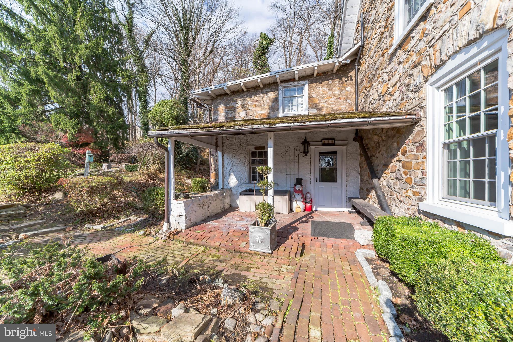 Front porch and brick walkway.