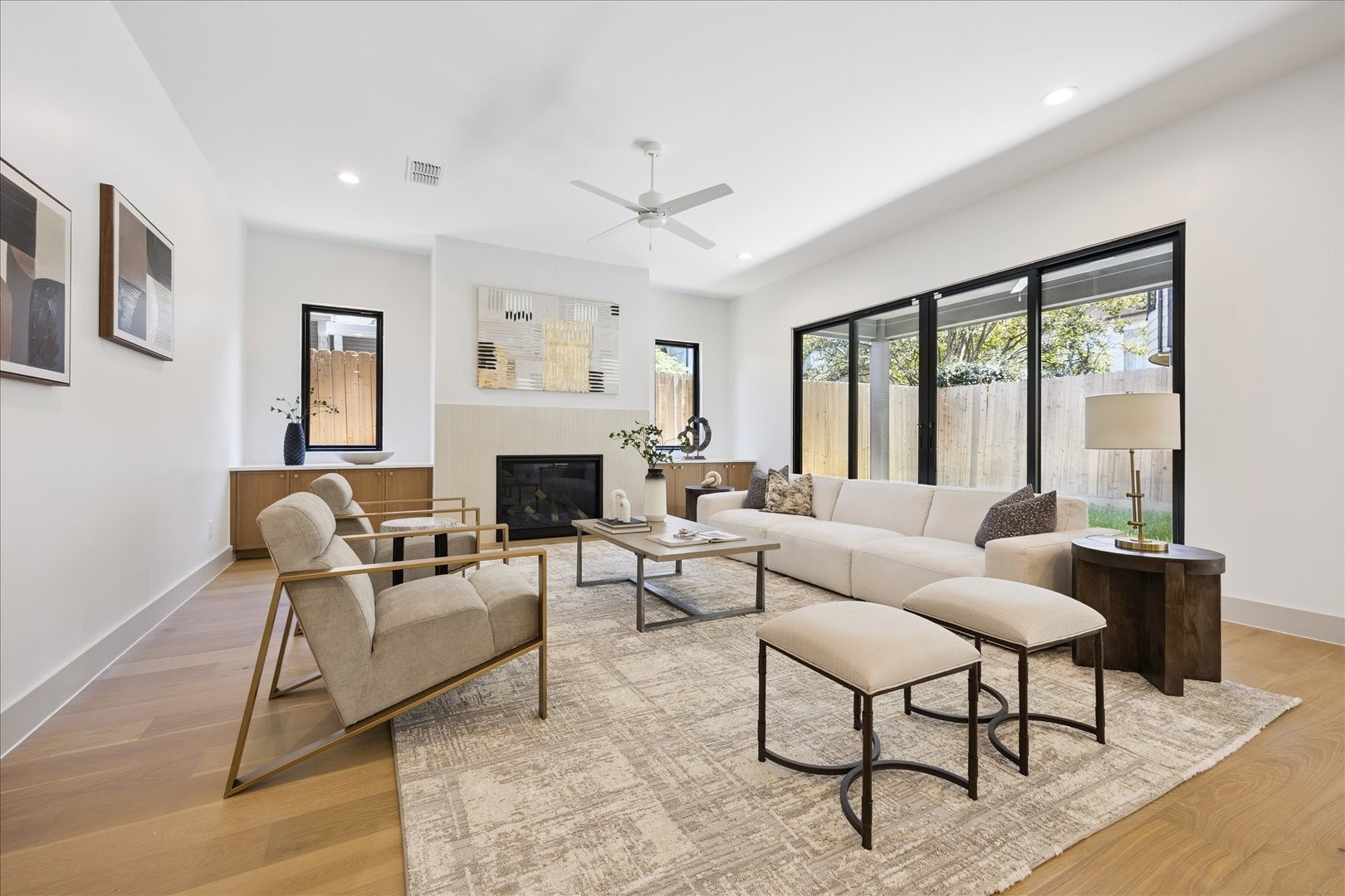 1209 Willard Street Houston, TX 77006 - Photo 13 of 35 a living room with furniture a large window and a fireplace