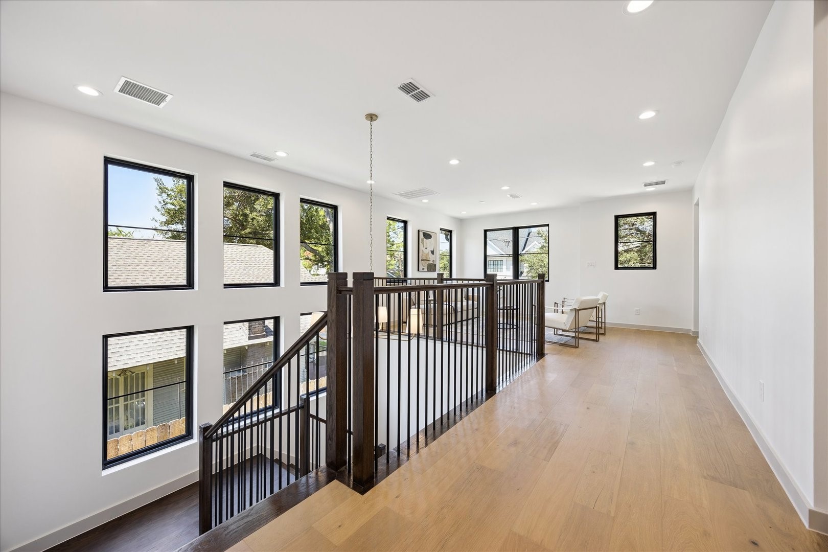 1209 Willard Street Houston, TX 77006 - Photo 18 of 35 a view of a hallway with windows and stairs