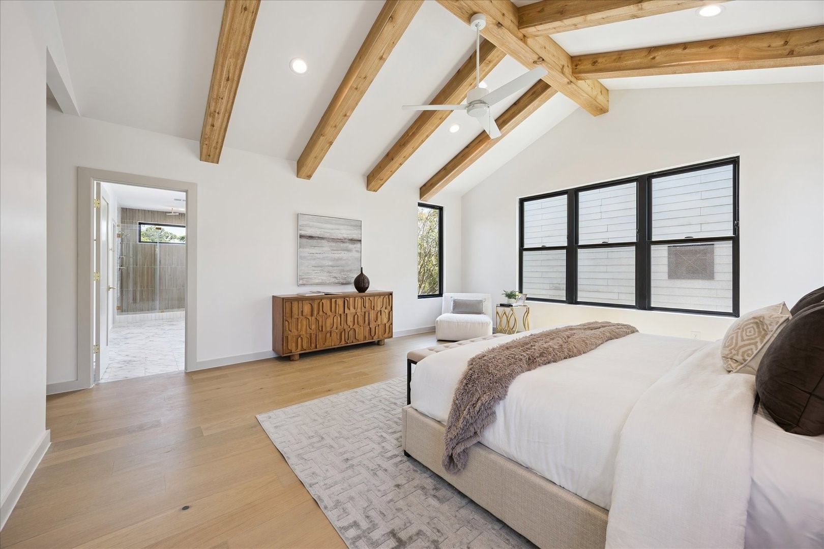 1209 Willard Street Houston, TX 77006 - Photo 20 of 35 a bedroom with a large bed and a large window