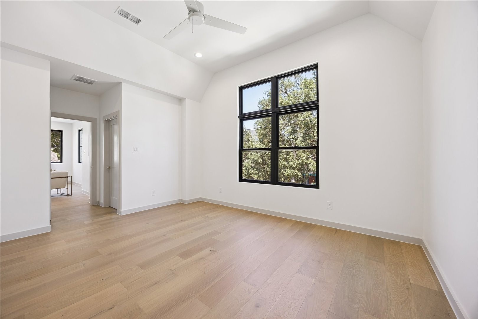 1209 Willard Street Houston, TX 77006 - Photo 27 of 35 wooden floor in an empty room with a window