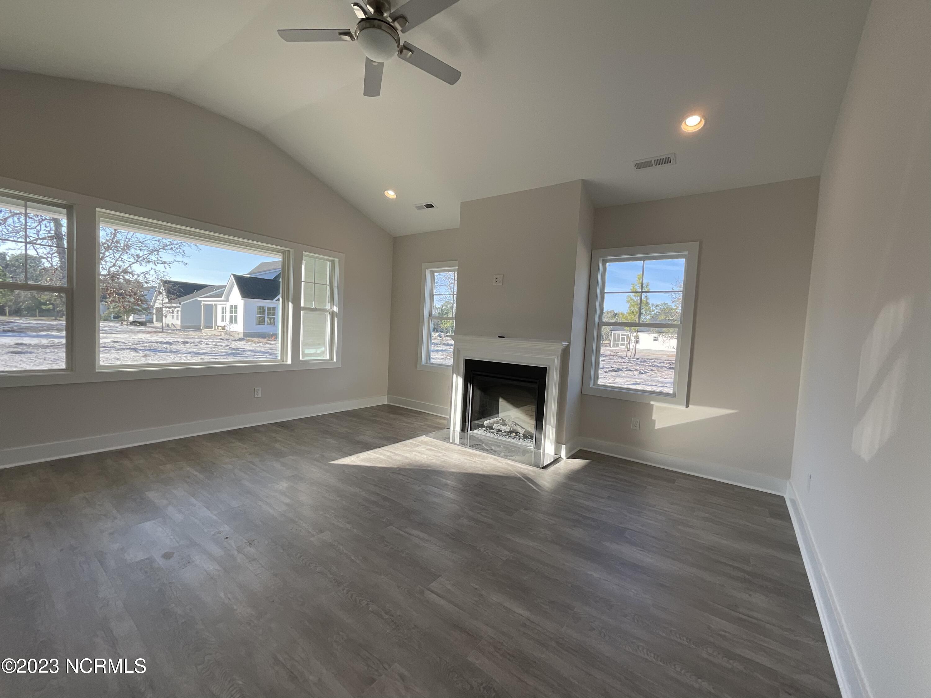 889 Nicklaus Road Boiling Spring Lakes, NC 28461 - Photo 3 of 11 PICTURE WINDOW AND VAULTED CEILING