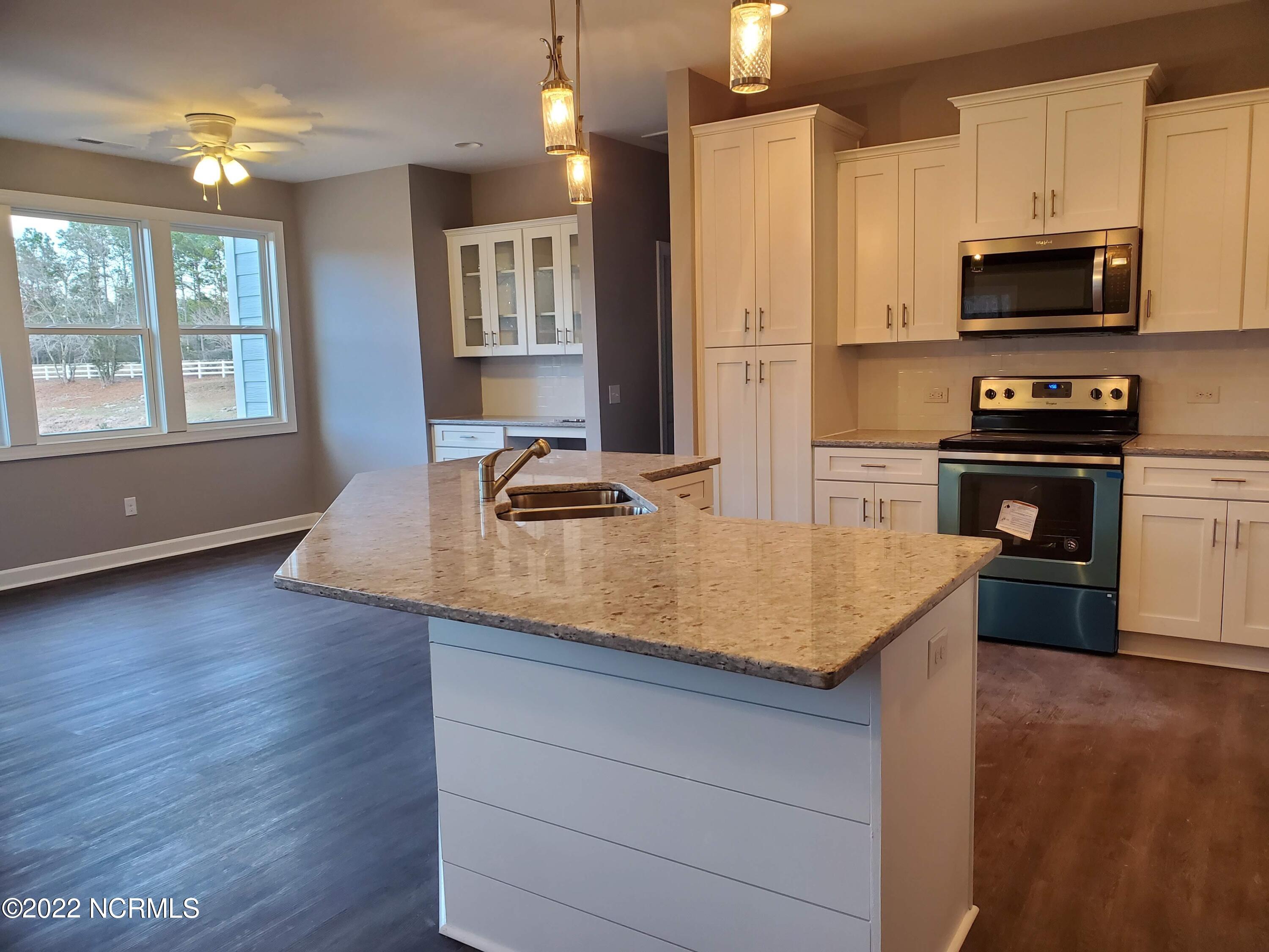 889 Nicklaus Road Boiling Spring Lakes, NC 28461 - Photo 8 of 11 Open Kitchen and Dining