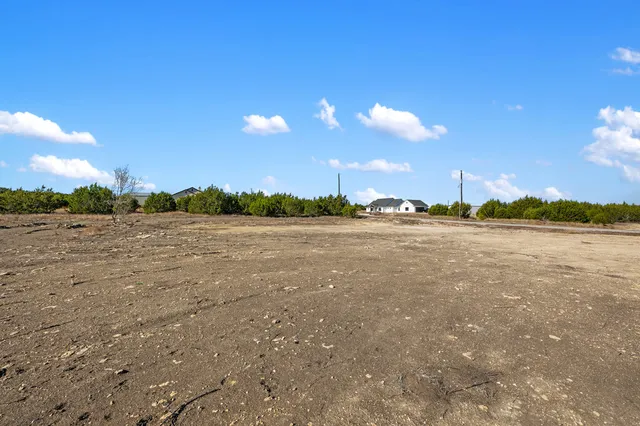 a view of a lake with sunset