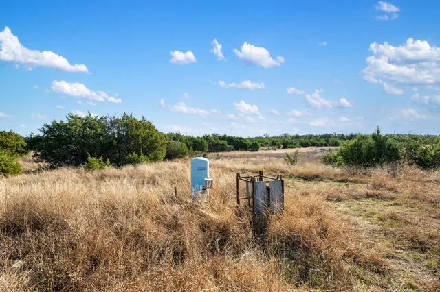 a view of a lake with houses in the back