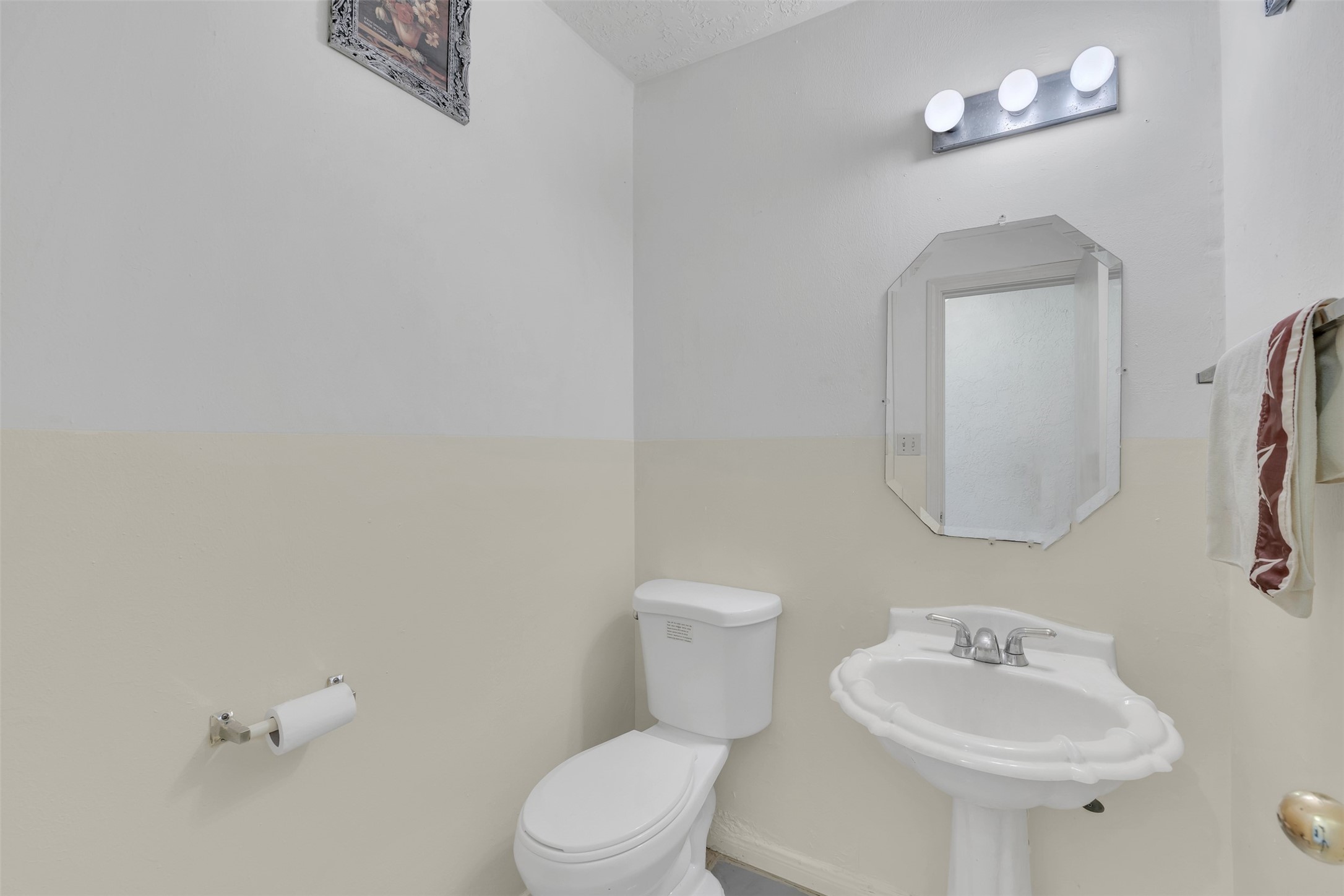 15619 Beechnut Street Houston, TX 77083 - Photo 8 of 29 Conveniently located half bath on the main floor for guests.