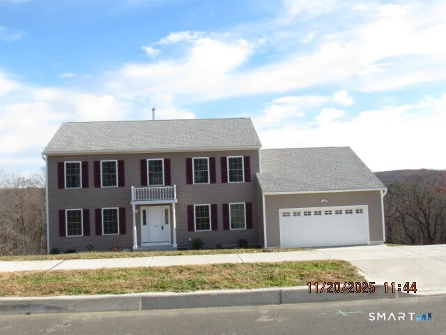 a view of a house with a street