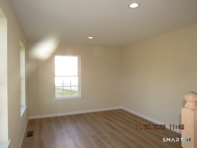 31 Warm Earth Road Naugatuck, CT 06770 - Photo 4 of 31 an empty room with wooden floor and windows