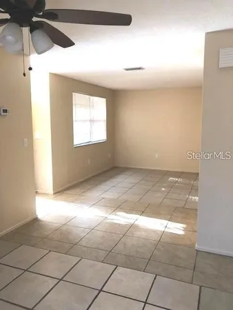 a view of an empty room and window
