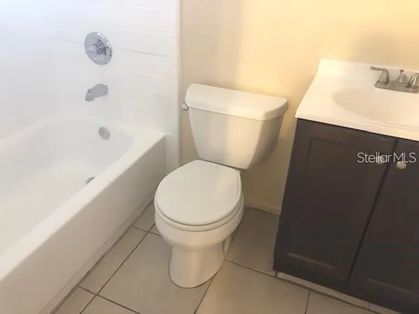 an empty room with a bathroom