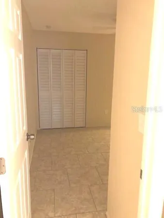 a view of an empty room with a window