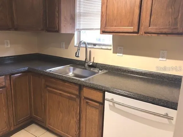 a kitchen with a sink and cabinets