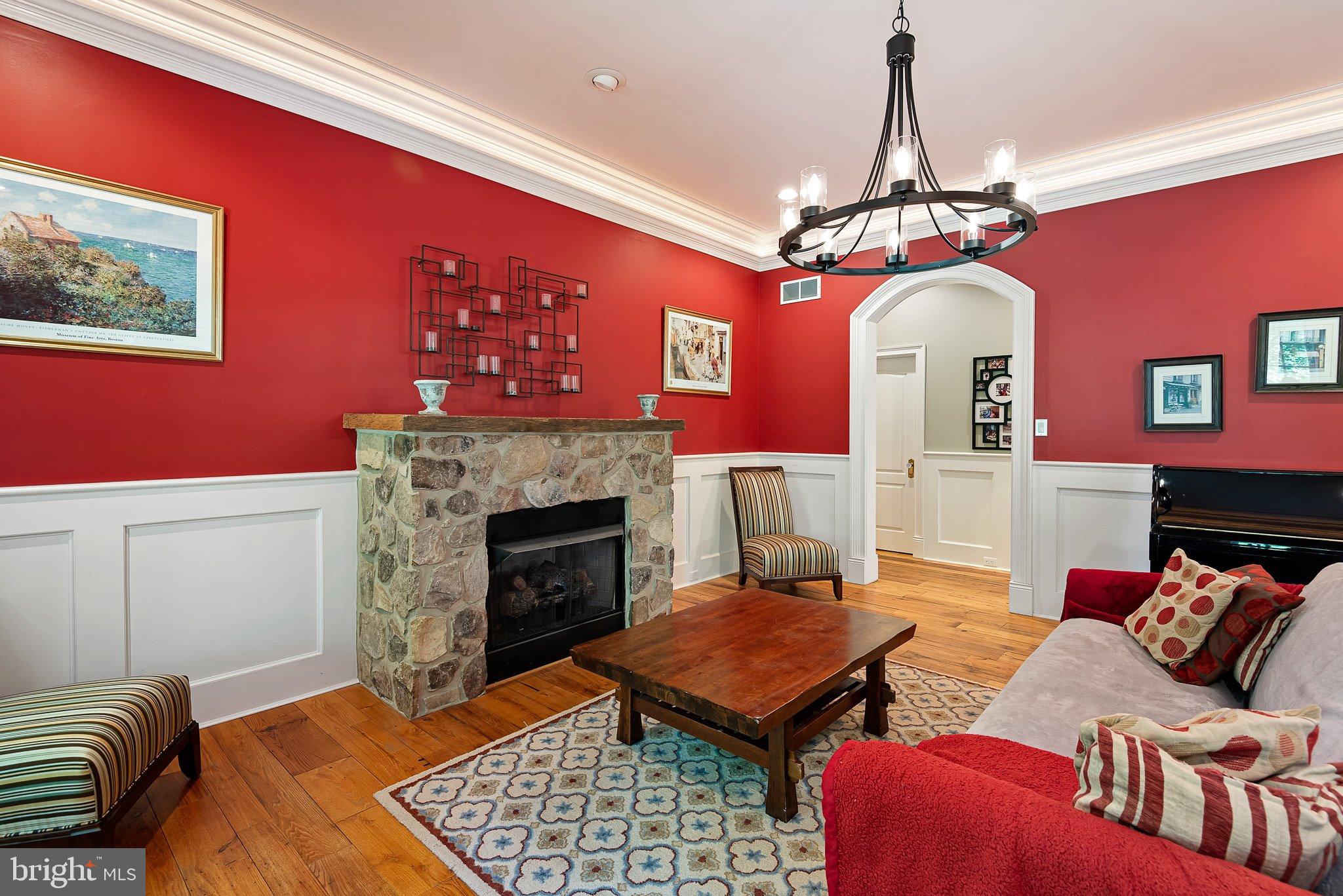 104 Timber Ridge Lane Chadds Ford, PA 19317 - Photo 9 of 65 a living room with furniture a dining table and a fireplace