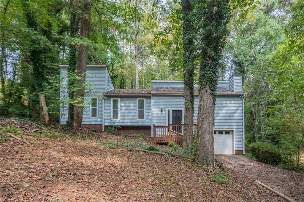 front view of a house with a trees