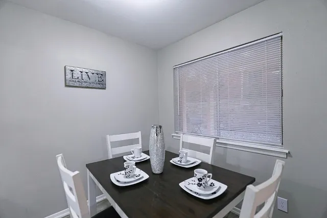 a view of a dining table and table in a room