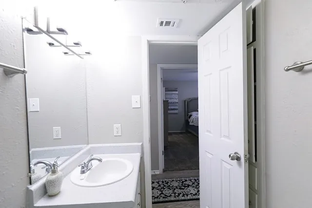 a bathroom with a shower and a tub
