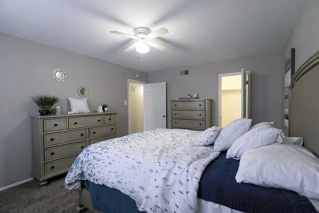 a bedroom with a bed and window