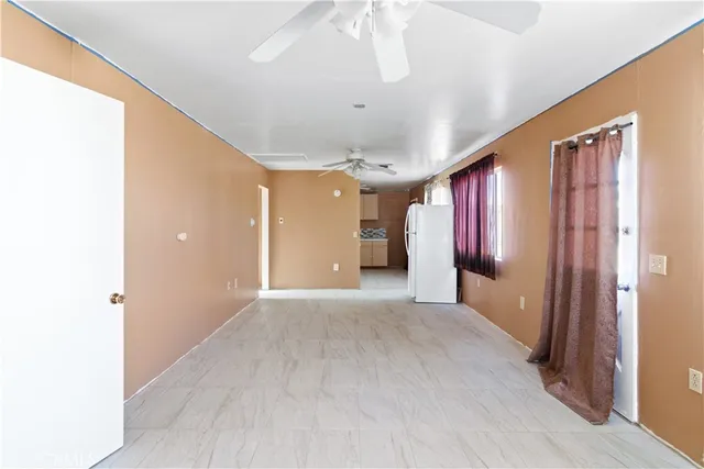 a view of a hallway with wooden shelves