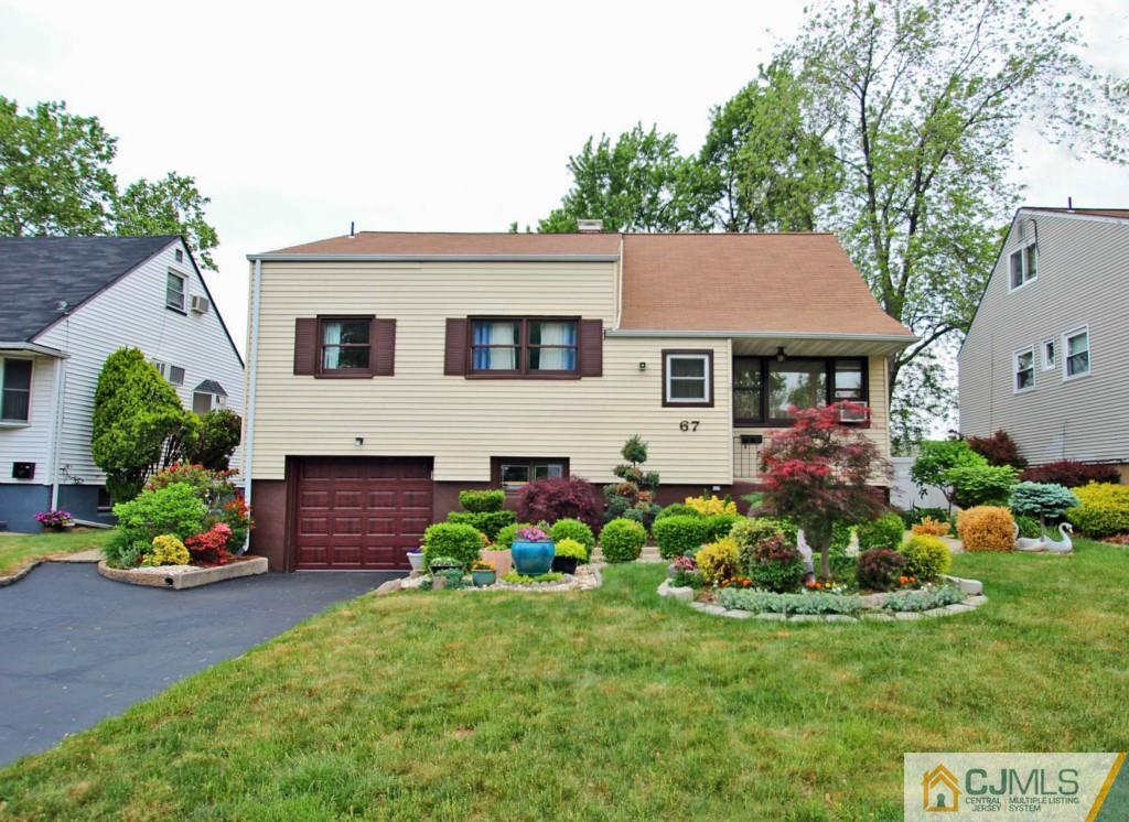 67 Brandywine Road Fords, NJ 08863 - Photo 1 of 25 a front view of house with a garden