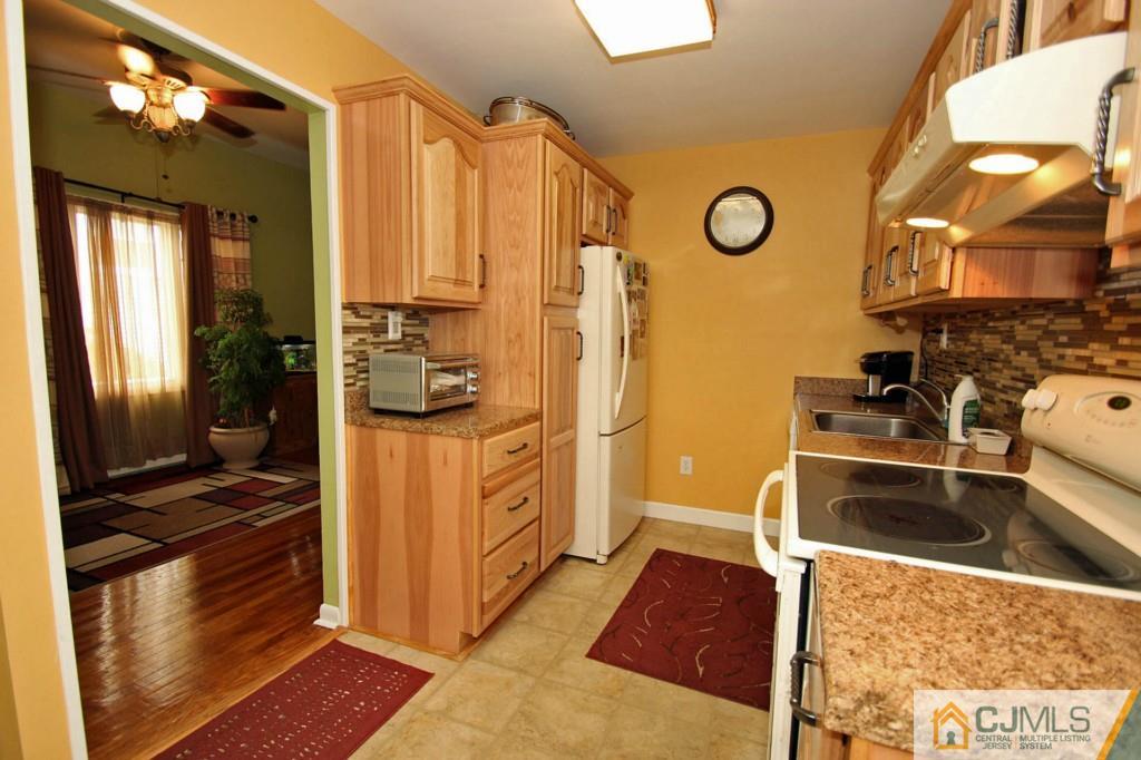 67 Brandywine Road Fords, NJ 08863 - Photo 12 of 25 a kitchen with stainless steel appliances granite countertop a refrigerator and a stove