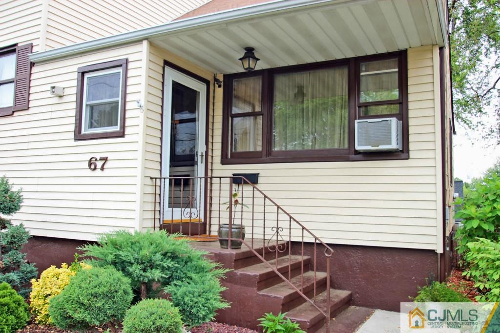 67 Brandywine Road Fords, NJ 08863 - Photo 3 of 25 a front view of a house with a yard