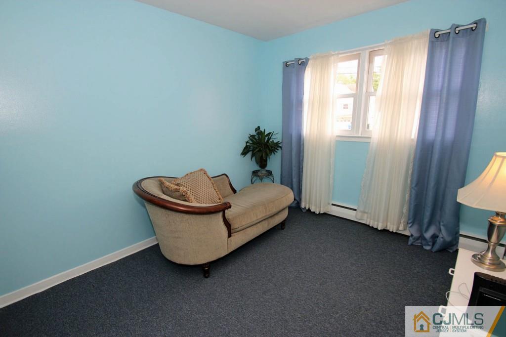 67 Brandywine Road Fords, NJ 08863 - Photo 21 of 25 a living room with furniture and a window