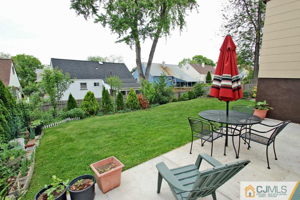67 Brandywine Road Fords, NJ 08863 - Photo 24 of 25 a view of a table and chairs in backyard