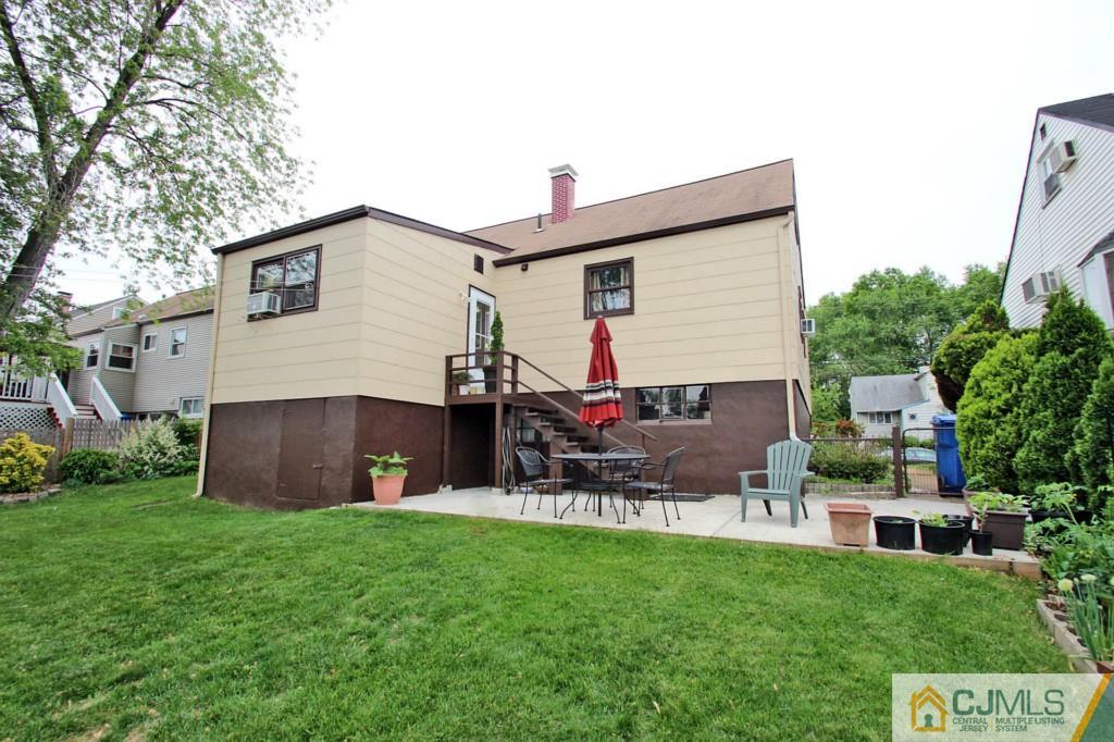 67 Brandywine Road Fords, NJ 08863 - Photo 25 of 25 a backyard of a house with table and chairs